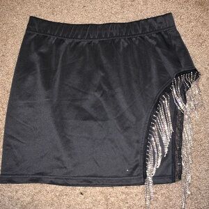 Sparkly party skirt with leg cut & accent